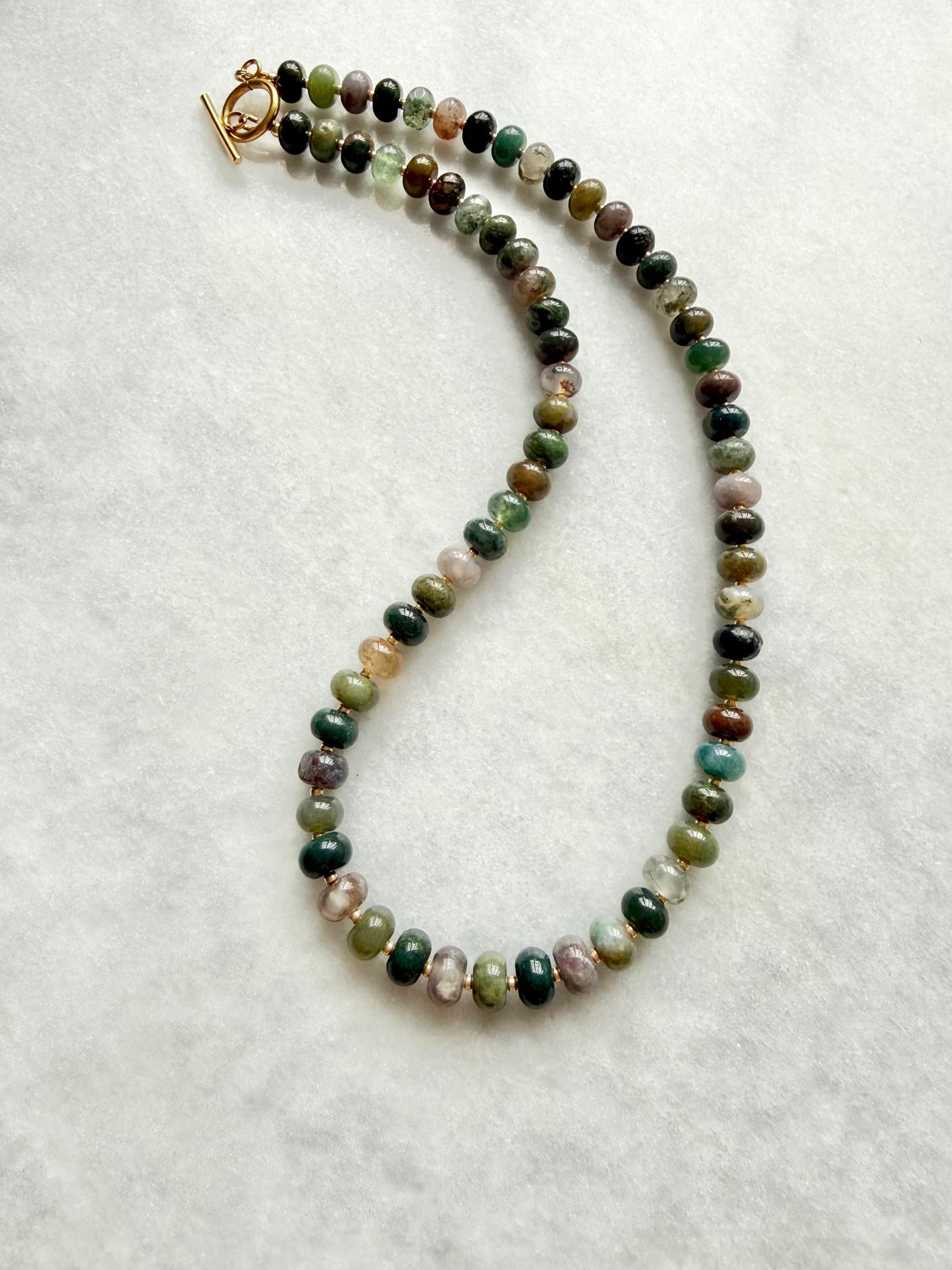 green beaded jewellery with gold spacer beads