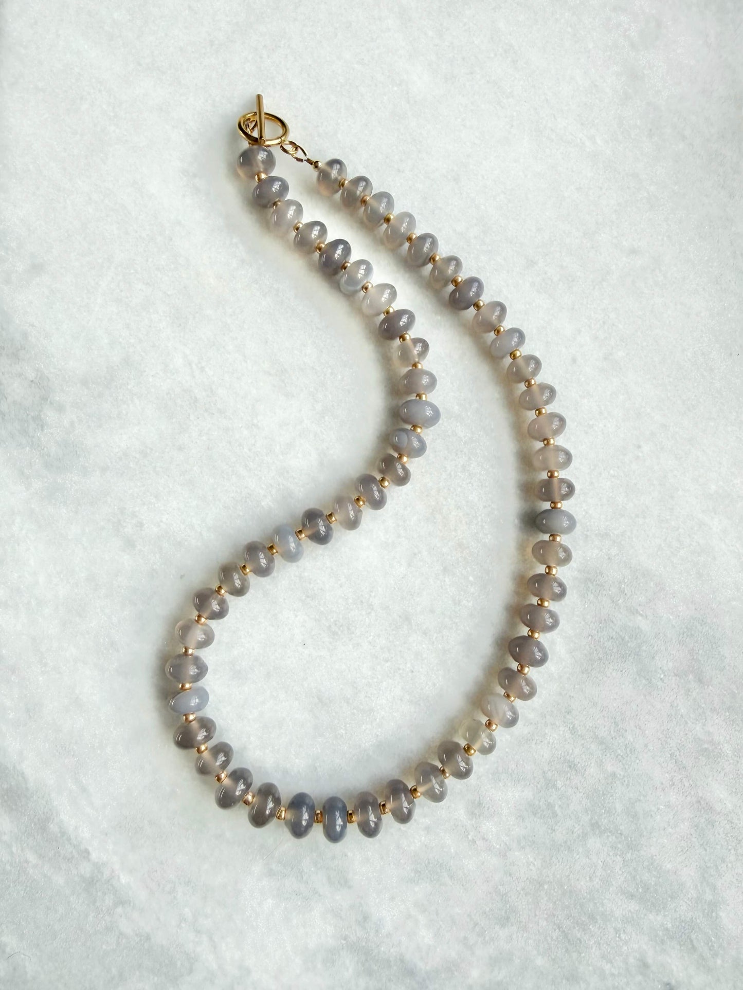 Necklace with small beads on a white background