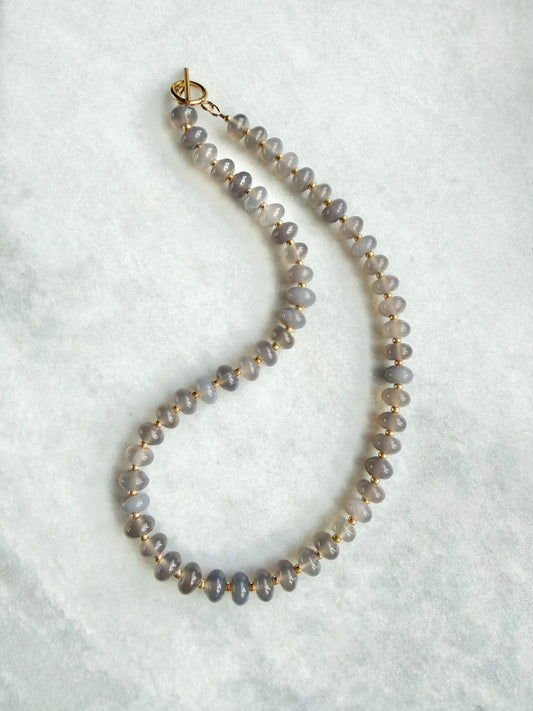 Necklace with small beads on a white background