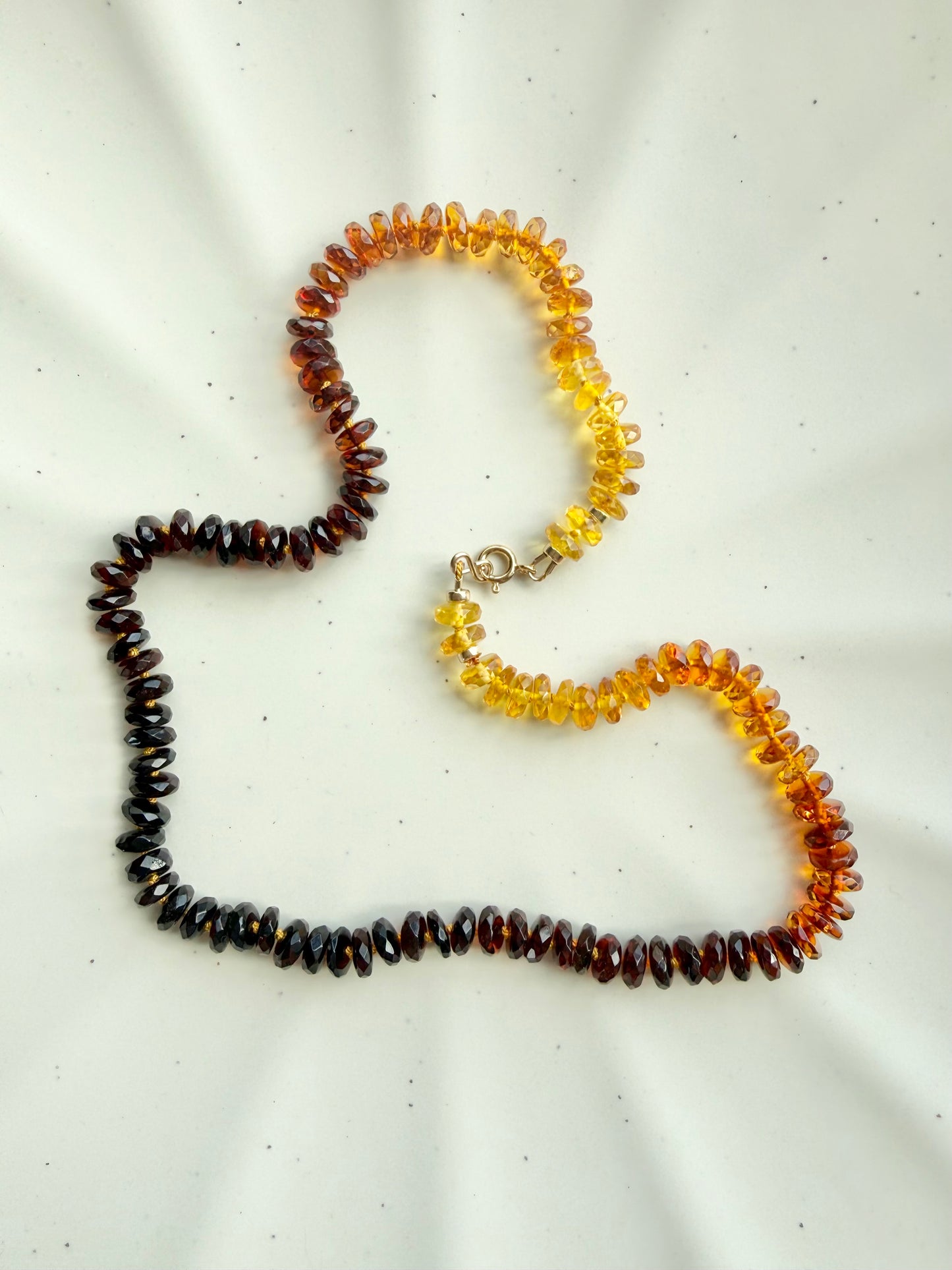 Necklace with multicolored beads on a white background