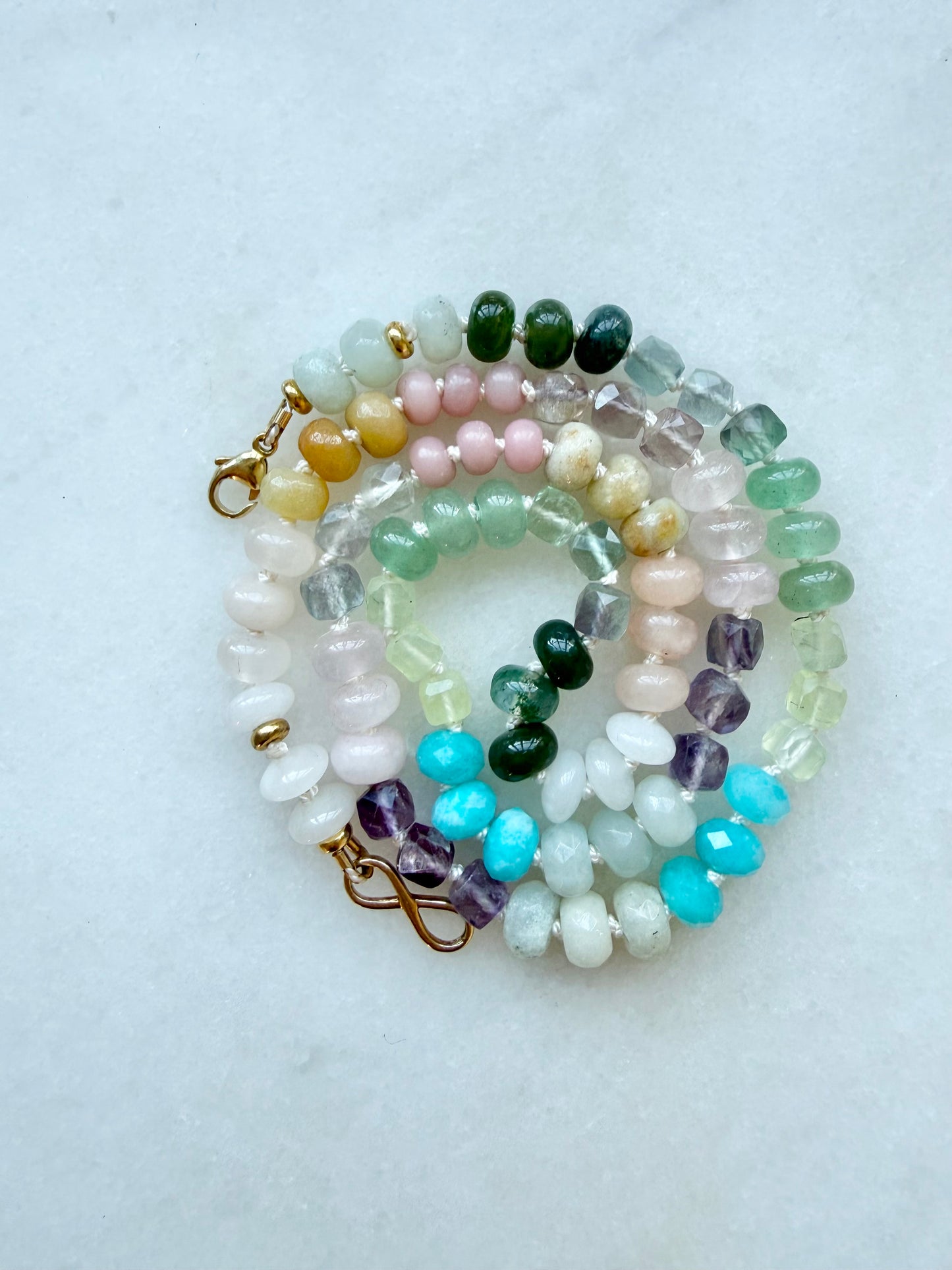 multicoloured necklace on a light background